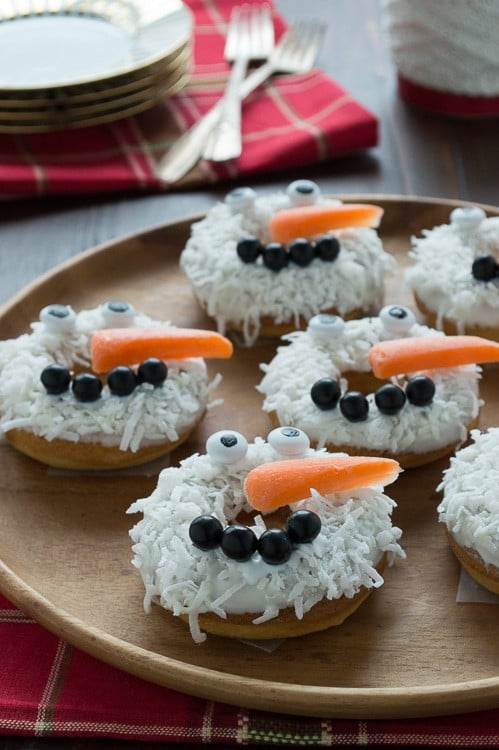 Baked caramel coconut donuts all dressed up to look like snowmen! These are SO adorable and easy to put together!!
