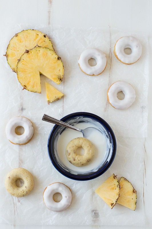 Pineapple Walnut Donuts with a white chocolate glaze and pineapple puree drizzle! 