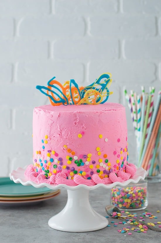 This pink confetti chocolate chip cake is so fun and and colorful. There are mini chocolate chips inside the cake! 