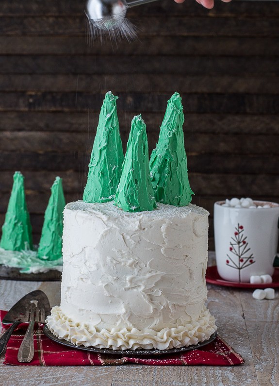 Easy gingerbread cake with vanilla bean buttercream, topped with snowy christmas trees! 