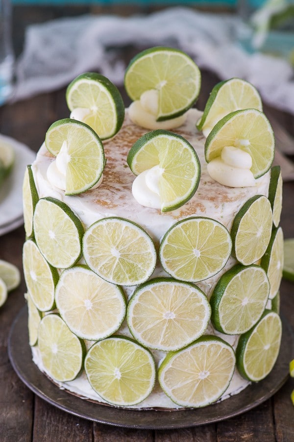 The best coconut lime cake! Coconut cake paired with fresh lime buttercream, cover the cake in lime slices for a fun presentation! 
