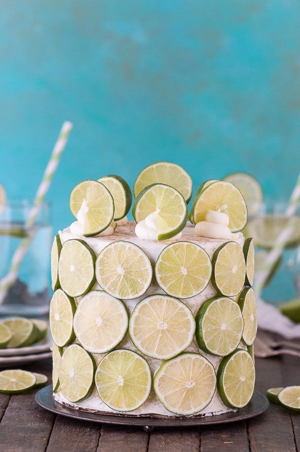 The best coconut lime cake! Coconut cake paired with fresh lime buttercream, cover the cake in lime slices for a fun presentation! 