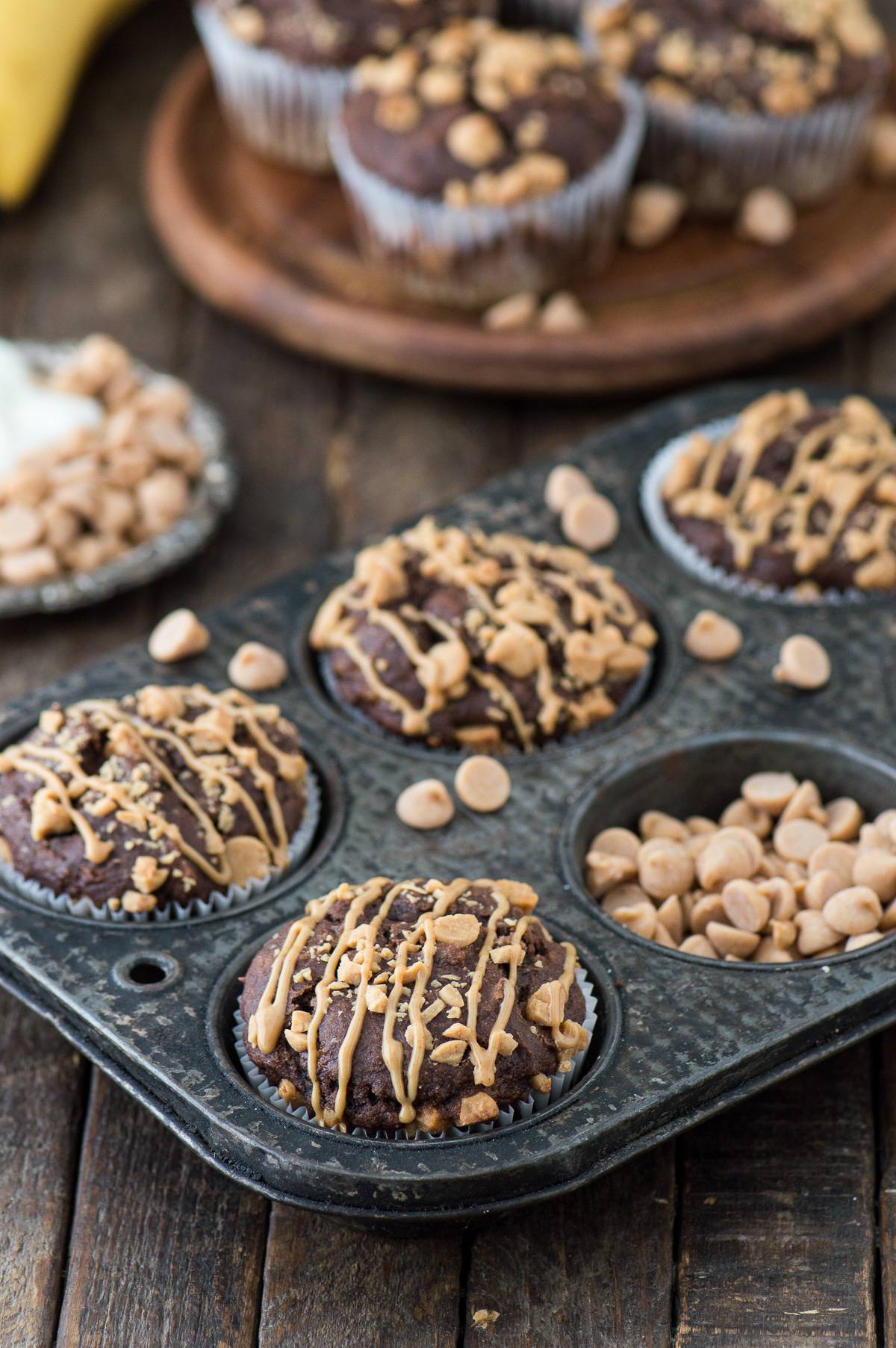 Healthy Chocolate Peanut Butter Chip Muffins made with greek yogurt, honey, and bananas!