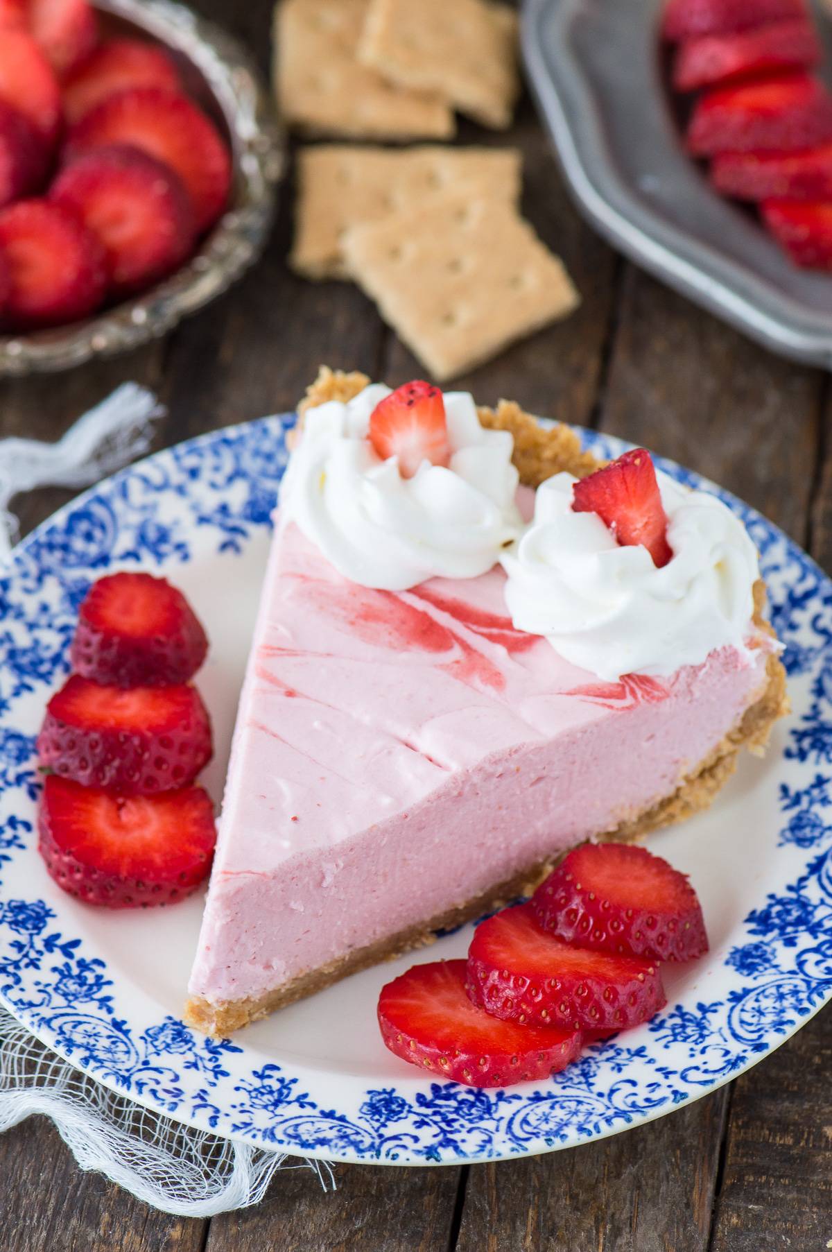 Fresh strawberry mousse pie with real strawberry puree and a homemade graham cracker crust!