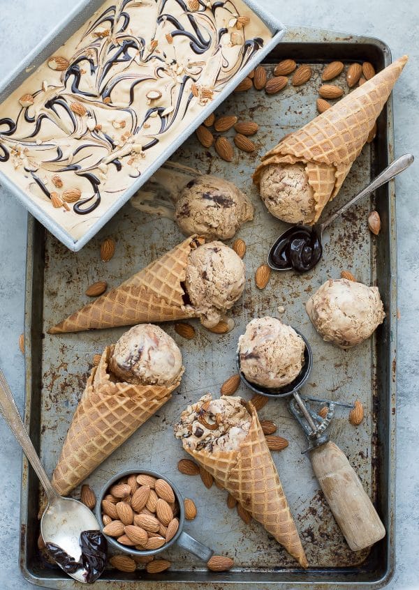 No churn mocha almond fudge ice cream! Incredibly easy coffee ice cream recipe loaded with almonds and hot fudge swirls!