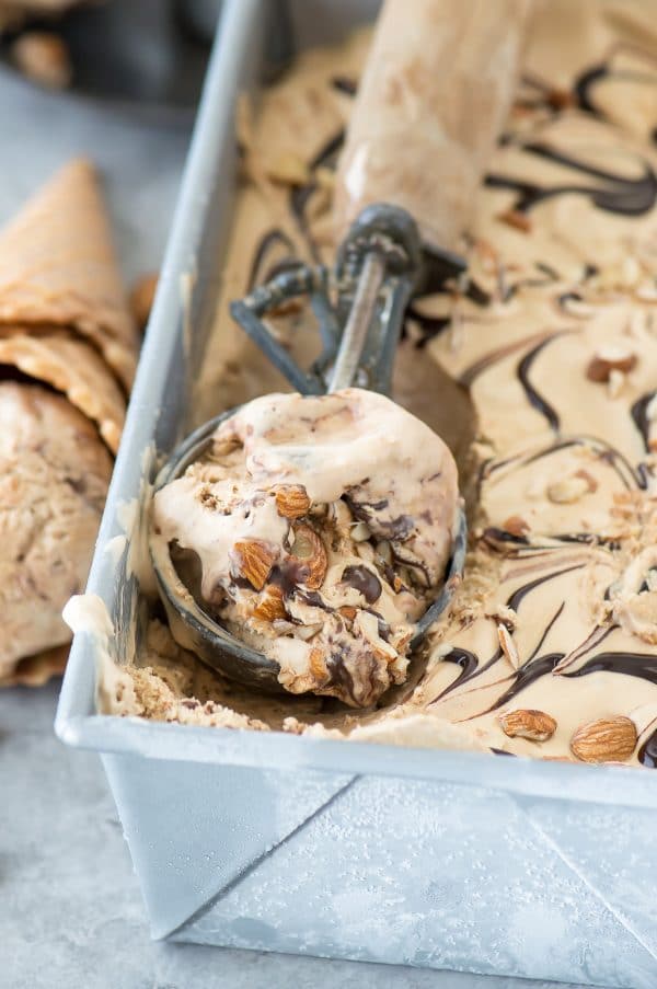 No churn mocha almond fudge ice cream! Incredibly easy coffee ice cream recipe loaded with almonds and hot fudge swirls!
