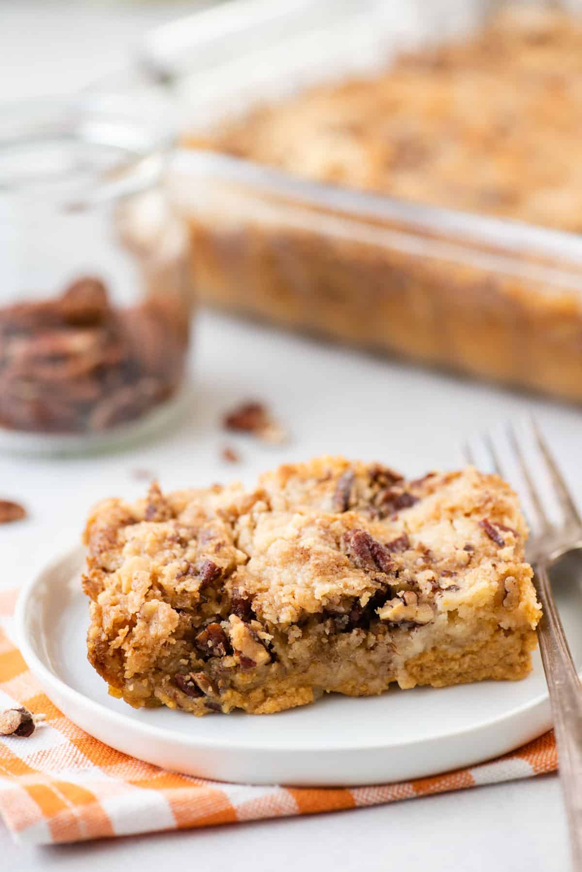 slice of pumpkin dump cake on white plate