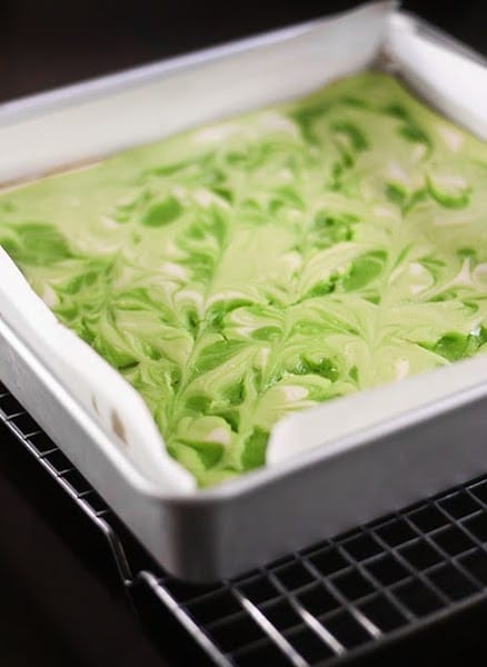 Key Lime Swirl Cheesecake Bars in a baking dish.
