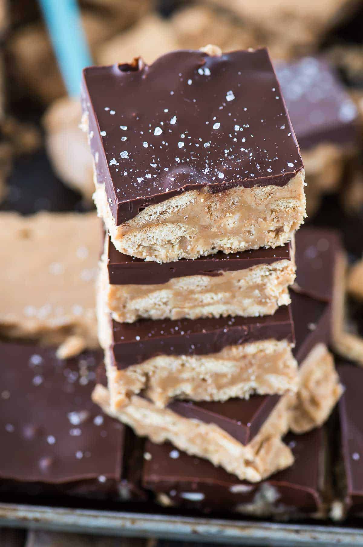 peanut butter bars with chocolate in a stack