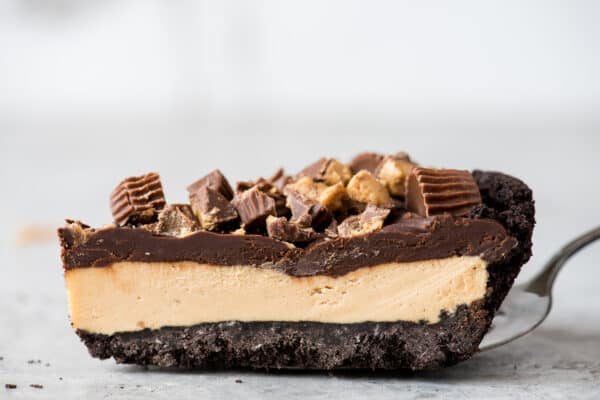 piece of chocolate peanut butter pie on metal spatula