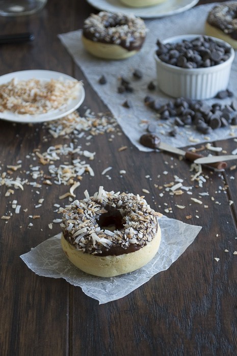 A coconut infused donut glazed with an easy to make chocolate ganache and topped with oven toasted coconut, takes only 10 minutes to bake! 