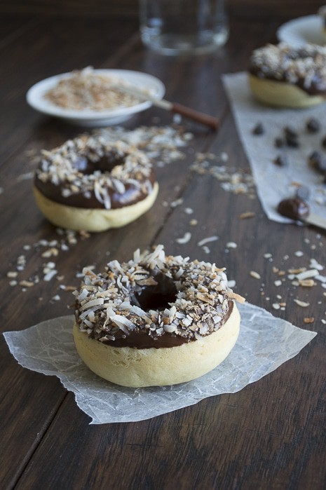 A coconut infused donut glazed with an easy to make chocolate ganache and topped with oven toasted coconut, takes only 10 minutes to bake! 