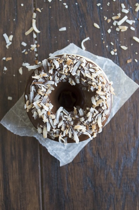 A coconut infused donut glazed with an easy to make chocolate ganache and topped with oven toasted coconut, takes only 10 minutes to bake! 