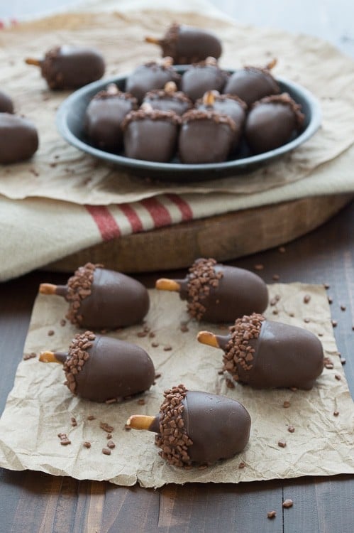 oreo balls that look like acorns on piece of brown paper