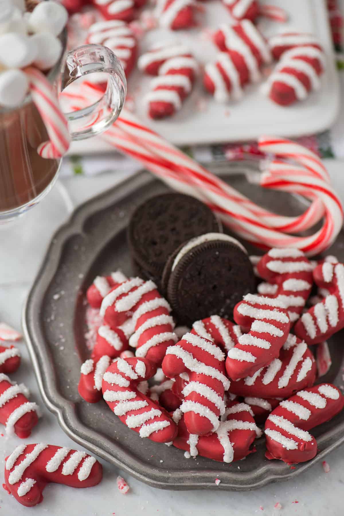 candy cane shaped oreo balls on metal plate