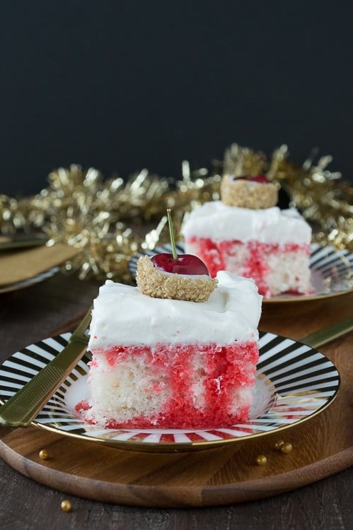 A poke cake infused with champagne and cherry, all topped with white chocolate cherries dipped in gold glitter! This would be perfect for New Year’s Eve!