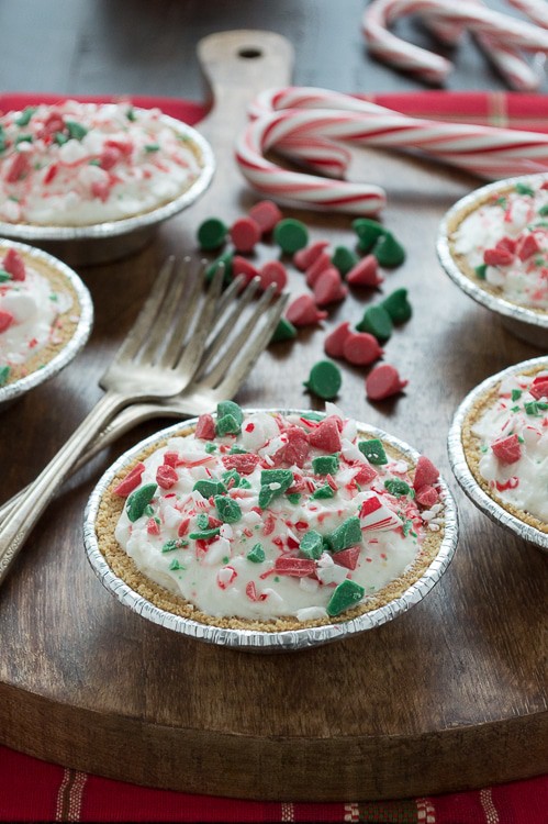 No bake mini white chocolate mousse pies are terrific for Christmas! Top them with red and green holiday chocolate chips! 