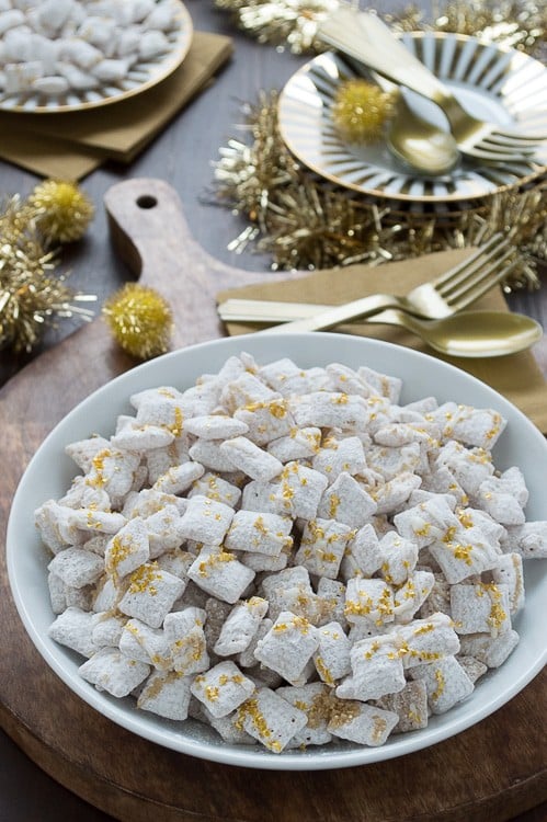 Easy white chocolate puppy chow with gold sprinkles and edible gold stars! This is perfect to make for New Year's Eve!