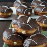 Cream Filled Chocolate Football Donuts - use refrigerated biscuits to make cream filled donuts! Decorate them to look like footballs for game day!