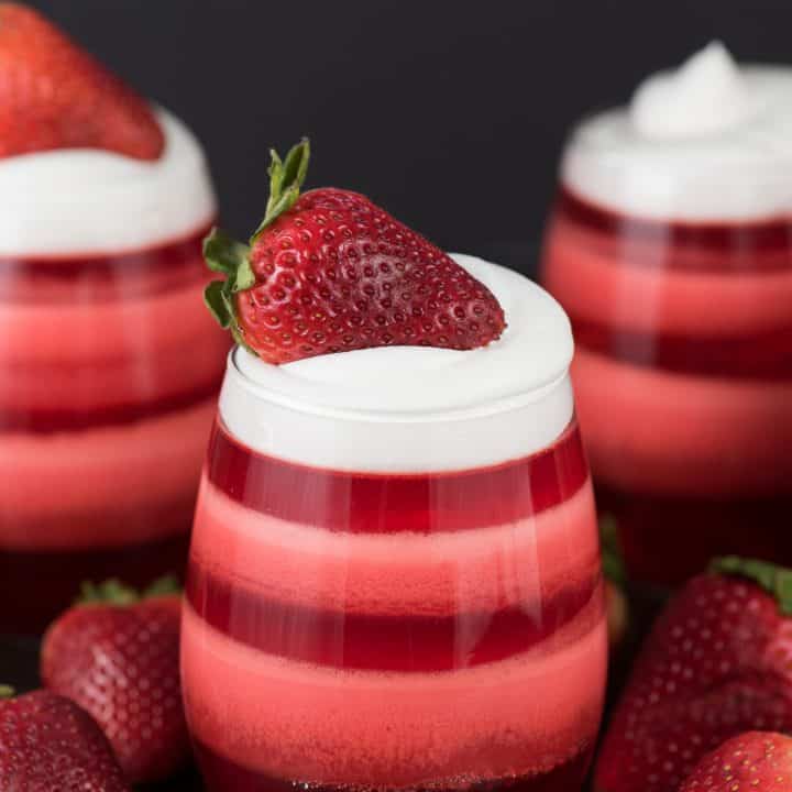 Layered Strawberry Jello Cups - the most popular jello cups on pinterest! You have to see these!
