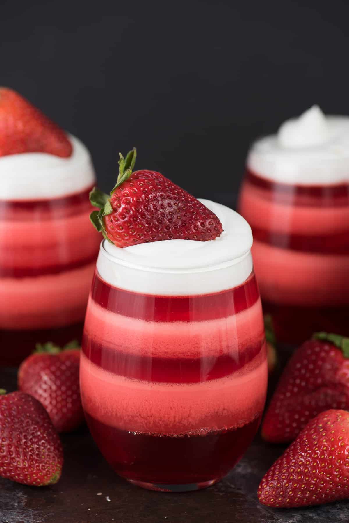 Layered Strawberry Jello Cups - the most popular jello cups on pinterest! You have to see these!