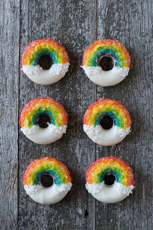 Rainbow Donuts - these fun donuts are made using fruity pebbles, white chocolate and shredded coconut! 