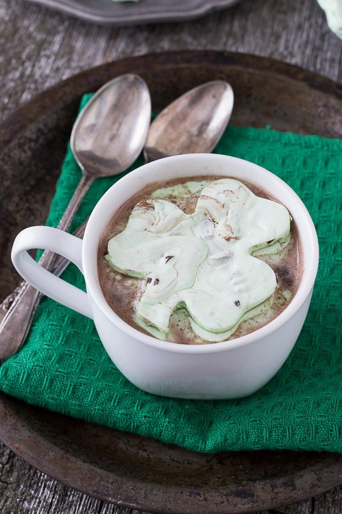Mint Chocolate Chip Shamrock Marshmallows in a mug of hot cocoa.