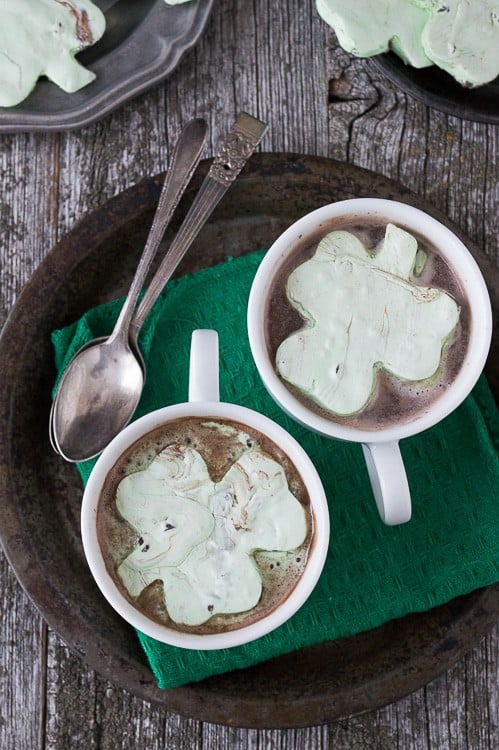 Mint Chocolate Chip Shamrock Marshmallows in two Cups of Hot Cocoa