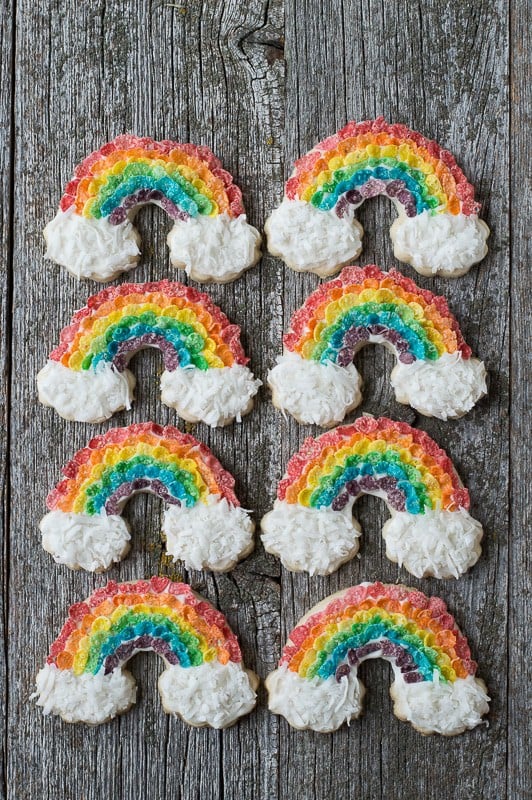 S closeup of Eight Rainbow Sugar Cookies with fruity pebbles and shredded coconut to make a delicious rainbow cookies recipe. 