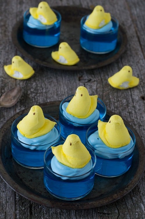 blue jello in glass bowl with yellow peep on top