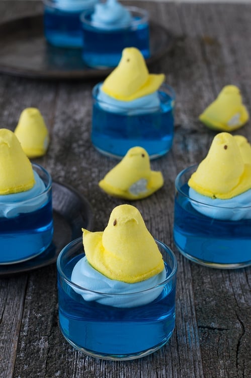 blue jello in glass bowl with yellow peep on top