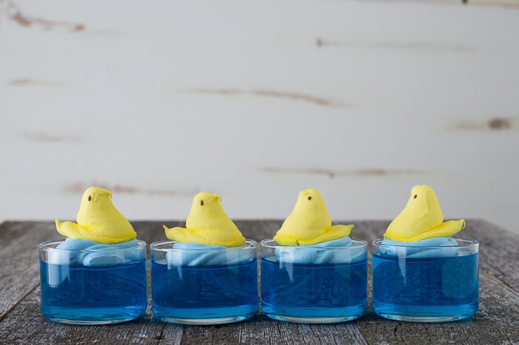 blue jello in glass bowl with yellow peep on top, 4 in a row