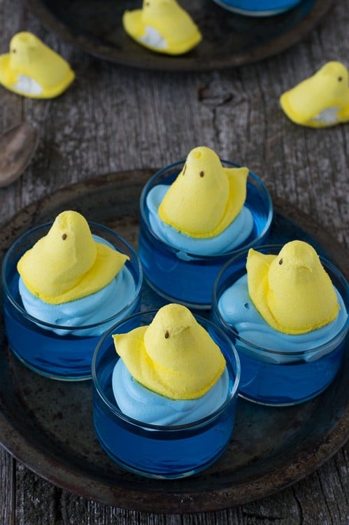 blue jello in glass bowl with yellow peep on top