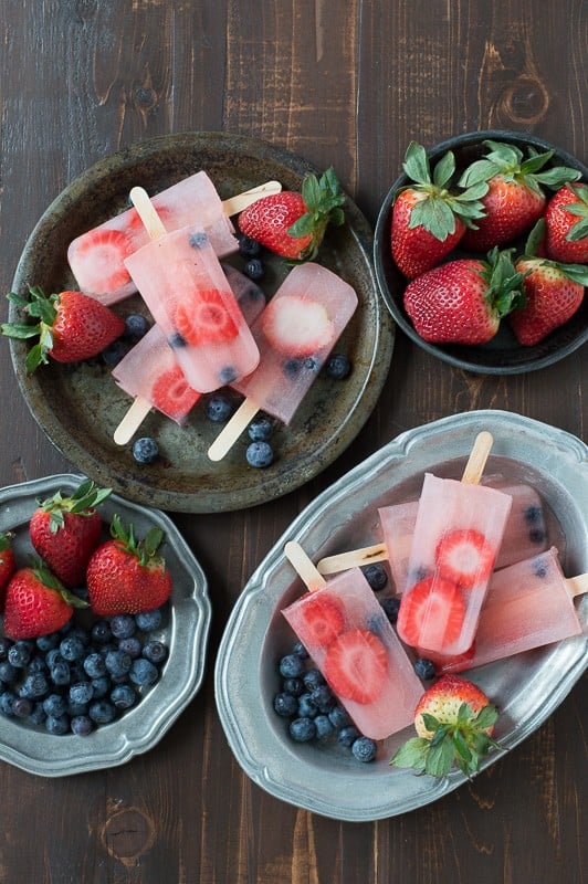 Berry Lemonade Popsicles are perfect for summer with fresh strawberries and blueberries! 