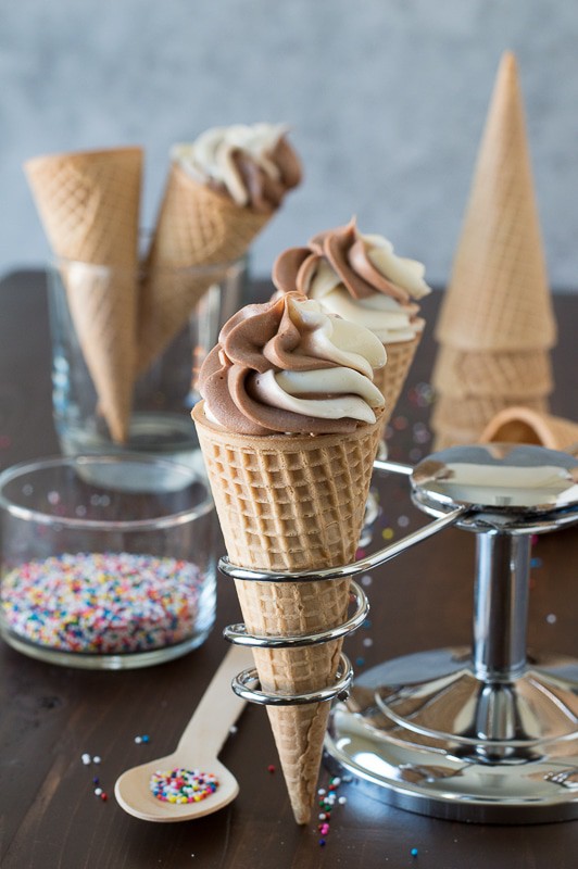 Chocolate Vanilla Cheesecake Ice Cream Cones - no bake chocolate vanilla cheesecake swirled into ice cream cones! The best way to eat cheesecake!