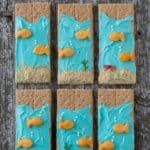 Six delicious and easy Under the Sea Graham Crackers on a wooden table.