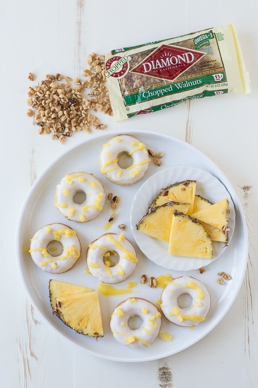 Pineapple Walnut Donuts with a white chocolate glaze and pineapple puree drizzle! 