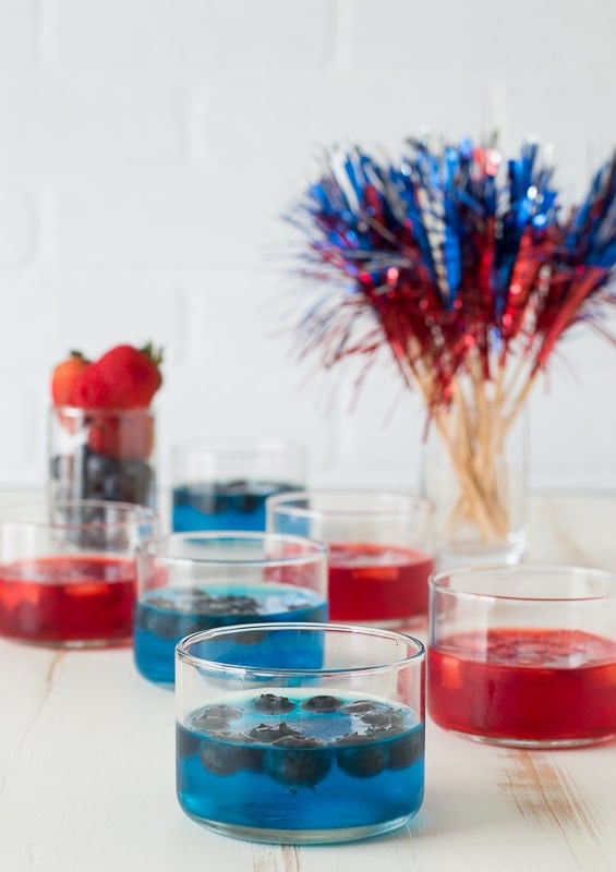 blue jello in glass cup on white background