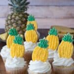 Pineapple Cupcakes - crushed pineapple in the batter and in the frosting! Top them with pineapple cookies or pineapple slices!