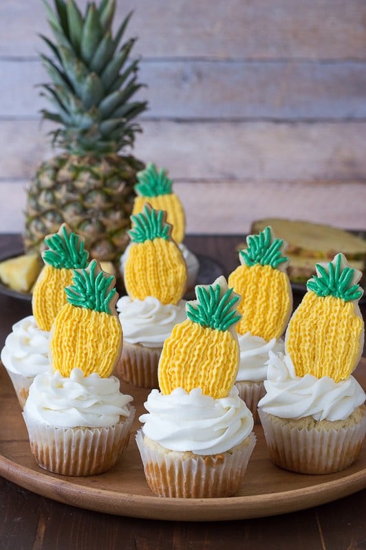 Pineapple Cupcakes - crushed pineapple in the batter and in the frosting! Top them with pineapple cookies or pineapple slices! 