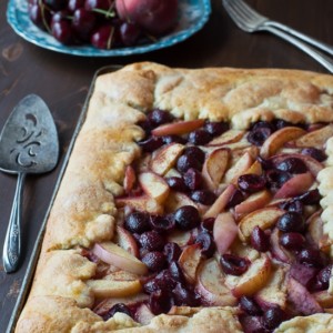 Cherry Peach Slab Pie - an easy open face pie made on a baking sheet! The crust is amazing!