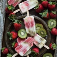 Creamy Strawberry Kiwi Popsicles - homemade popsicles made with fresh strawberries, kiwis, and vanilla yogurt!