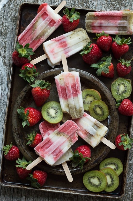 Creamy Strawberry Kiwi Popsicles - homemade popsicles made with fresh strawberries, kiwis, and vanilla yogurt! 
