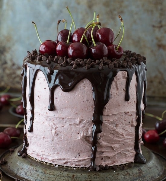 A 3 layer white cake filled with chopped cherries and cherry buttercream. Topped with a drizzled chocolate ganache and fresh cherries!