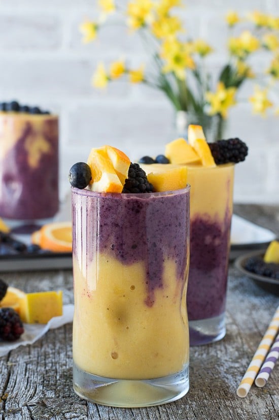 This two layer Hawaiian Berry Smoothie has an orange mango layer and a berry layer! Top the smoothie with a skewer filled with fresh fruit! 