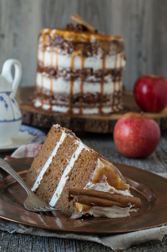 This apple spice cake with caramel drizzle is the best naked cake for fall! With applesauce in the batter, it’s moist and delicious! 