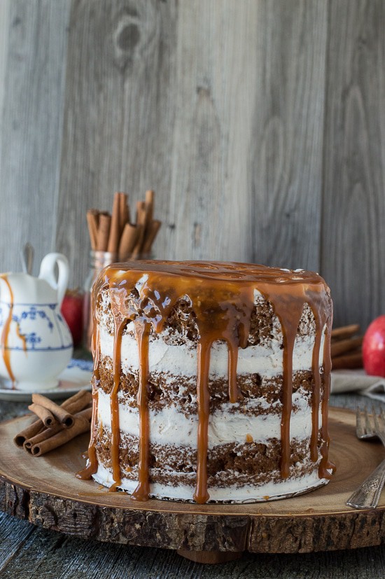 This apple spice cake with caramel drizzle is the best naked cake for fall! With applesauce in the batter, it’s moist and delicious! 