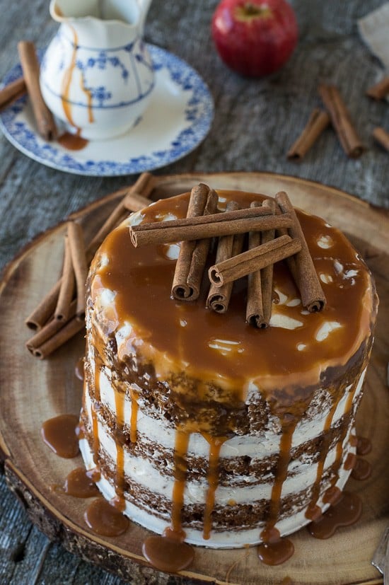 This apple spice cake with caramel drizzle is the best naked cake for fall! With applesauce in the batter, it’s moist and delicious! 