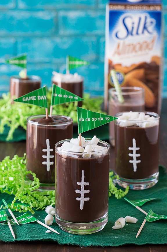 These football pudding cups are so cute for game day! Jazz them up with some white football stitches, chocolate curls, and a mini pennant! 