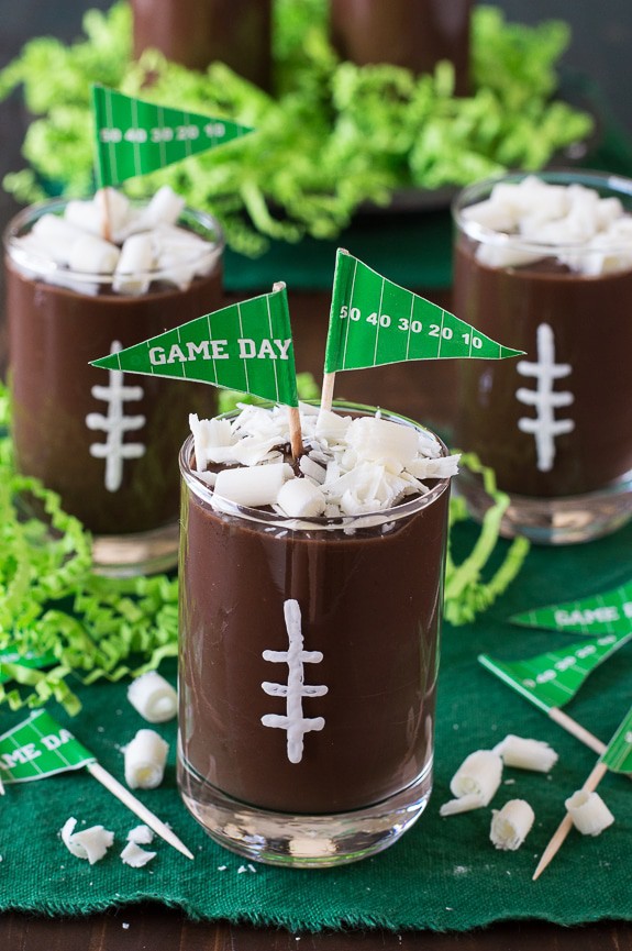 These football pudding cups are so cute for game day! Jazz them up with some white football stitches, chocolate curls, and a mini pennant! 
